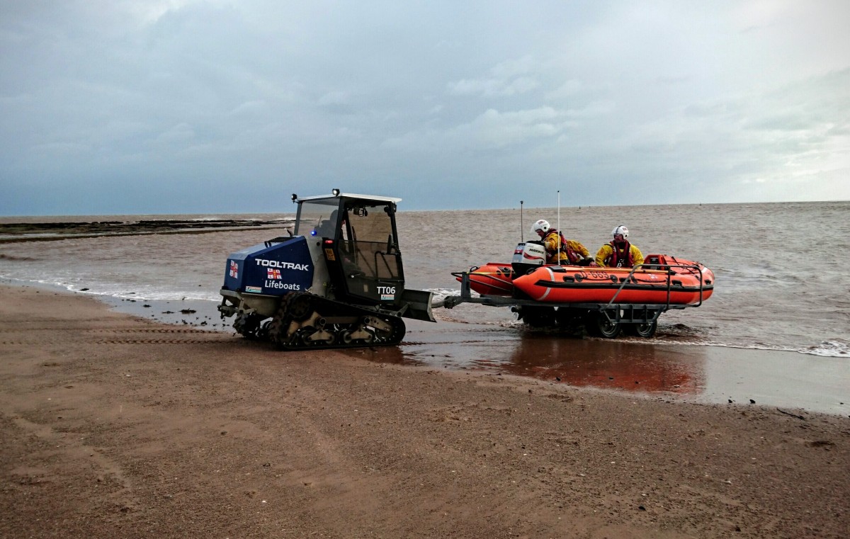 Exmouth RNLI volunteers assist injured lady on Sandy Bay beach